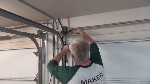 what causes a garage door spring to break